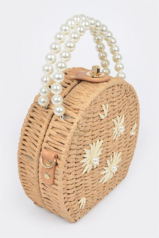 side view of pearl and straw handbag